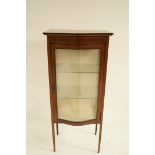 An Edwardian mahogany display cabinet with boxwood stringing and bow fronted glass door, H 32.5cm W