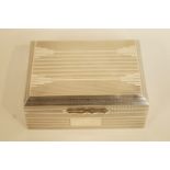 A silver cigarette box, Birmingham 1946, with engine turned decoration, 11.5 cm long