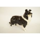 A Beswick figure of a black and white border collie, printed marks and painted marks, H 13.5cm