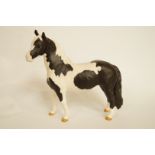 A black and white matt glazed Beswick pit pony, printed marks in black, H 17cm