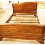 A modern teak sleigh bed, W 147cm