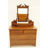 An Edwardian mahogany dressing table, the raised back with swing frame mirror, H 168cm W 106cm D