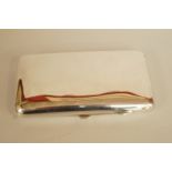 A silver cigar case, A & J Zimmerman, Birmingham 1919, of plain rectangular form, 13 cm long, 150 g