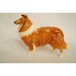 A Beswick figure of a brown and white Bearded Collie, printed marks in black, original sticker and