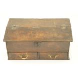 An early George III oak bible box, the hinged sloped front above two drawers, H 33cm W 72cm D 42cm