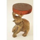 A Fair Trade wooden hand crafted table in the form of an elephant, H 50cm