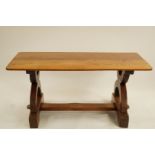 An Arts and Crafts style table with two plank oak top, H 70cm W 158cm D 74cm