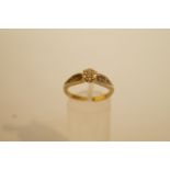 A single stone diamond ring, stamped '9ct', the brilliant cut illusion set, finger size N, 2.9 g