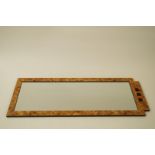 A pair of Art Deco style hanging wall mirrors in printed burr walnut frames, 121cm x 45cm