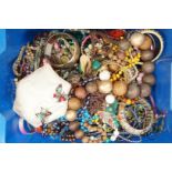 A large quantity of costume jewellery, primarily beads and bangles