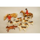 Two Beswick huntsmen and horses, a fox and eight hounds, printed marks in black