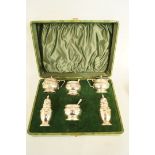 A six piece silver condiment set, Birmingham 1939, with Irish import marks, comprising two peppers,