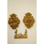 A pair of late 19th century gilded curtain tiebacks each in the form of an embossed lily and a