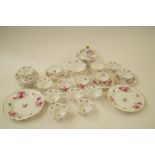 An English porcelain part tea service, circa 1830 decorated with pink and flower sprigs, and