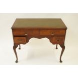 An early 20th century mahogany desk with faux leather insert