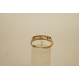 A six stone 9 carat gold half hoop ring, finger size R, 1.8 g gross