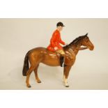 A Beswick figure of a mounted huntsman, H 22cm, printed marks in black, model number 1501