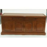 A 20th century middle eastern hardwood sideboard with scrolling flower carved friezes, H 81cm W