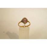 A diamond and pink sapphire 9 carat gold ring, finger size Q1/2, 1.9 g gross