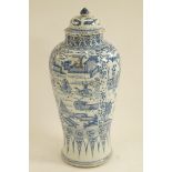 A 19th century Chinese porcelain floor standing vase and cover of baluster form painted in