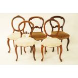 A pair of Victorian walnut balloon back chairs, a pair of Victorian mahogany balloon back chairs