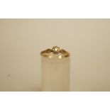 A single stone diamond 9 carat gold ring, the brilliant cut of approximately 0.03 carats illusion
