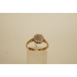 A nineteen stone diamond 9 carat gold cluster ring, the brilliant and single cut diamonds totalling