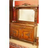 An Edwardian mahogany sideboard with mirrored back and carved with Art Nouveau style panels, H