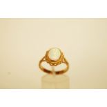 A single stone opal 9 carat gold ring, finger size N1/2, 3.9 g gross