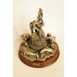 A cast metal and crystal model entitled "The Dance of the Dolphins" pattern number 3068, on wooden