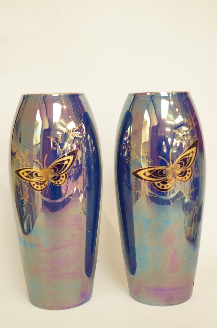 A pair of Devon Fieldings lustre glazed vases, printed in gilt and blue with butterflies, printed