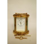 A Matthew Norman brass skeleton carriage clock with keys, H 18cm overall