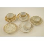 A Worcester porcelain Queens pattern tea cup and saucer, a Worcester fluted coffee cup and saucer,