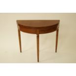 A 20th century mahogany demi lune card table with tapering fluted legs, H 77.5cm W 90cm D 45cm