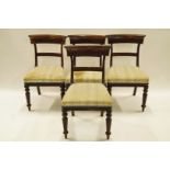 A set of four 19th century mahogany rail back chairs with stuffover seats and turned reeded