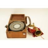 A compass in mahogany case, "Patt. 0195.A numbered G.R. 1943 A.PA 2069", W 27cm and a brass bugle