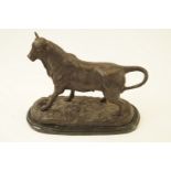 After J. L. Barye, A bronze figure of a bull on black marble plinth, H 27.75cm