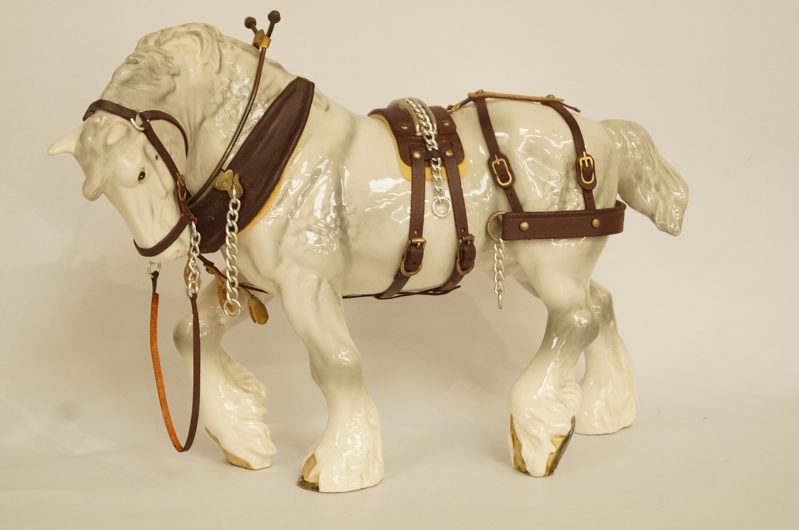 A Beswick harnessed large action shire horse in grey, 2578; harness damaged; printed marks in