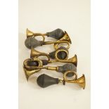 Six old brass horns