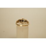 A five stone sapphire 9 carat gold ring, Birmingham 1993, finger size P1/2, 1.9 g gross