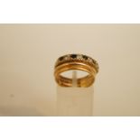 A sapphire and cubic zirconia 9 carat gold half hoop ring, finger size N; with a 9 carat gold