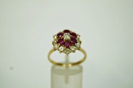 A ruby and diamond 18 carat gold cluster ring,