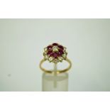 A ruby and diamond 18 carat gold cluster ring,