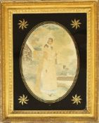 An early 19th century silk work picture of a lady in a landscape in verre eglomise glass and gilt