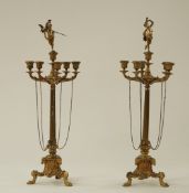 A pair of Empire style French ormolu candelabra each with five branches around a single sconce