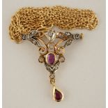 A diamond and ruby pendant brooch, stamped '750', in the Edwardian style,