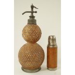 A French Soda syphon of double gourd form and caned cover and a leather covered flask