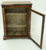 A Victorian walnut and marquetry standing display cabinet with gilt metal mounts,