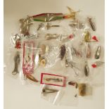 A box of lures including Allcocks, Hardy, Mepps, ABU,