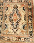 A North West Persian rug with central medallion on ivory field with extended spandrels with an all